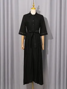 French vintage black maxi dress with hollow-out lace detail and belted waist