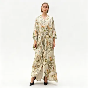 Full length view of loose printed maxi dress with V-neck and decorative metal buckle