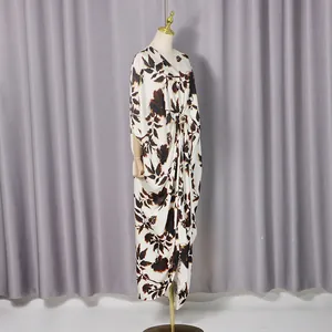 Elegant floral print kaftan maxi dress with V-neck and decorative waist buckle detail