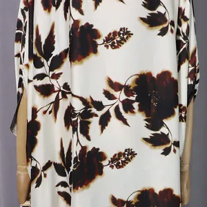 Detailed view of casual loose floral printed dress featuring soft silky fabric texture