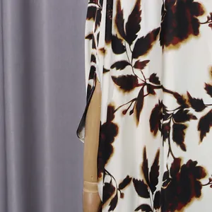 Close-up showing the side slit detail on this comfortable floral print loose maxi dress