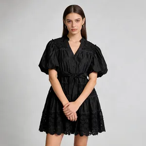Full view detail of black French style dress with V-neck, puff sleeves and lace hem
