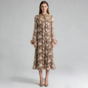 Detailed view of floral lace embroidery and elegant feather cuffs on a midi dress