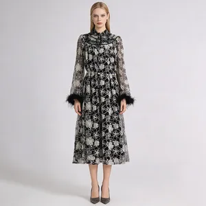 Full view of floral lace dress featuring standing collar and unique feather cuffs