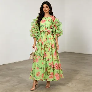 Full view of a green retro floral maxi dress with layered ruffle puff sleeves.
