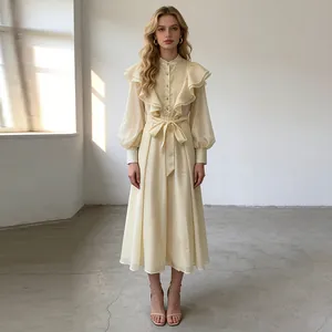 Full view of elegant cream retro palace dress with tiered ruffles and belted waist
