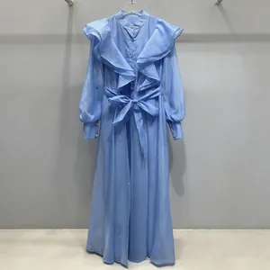 Romantic light blue vintage court style maxi dress with ruffles and a waist tie belt