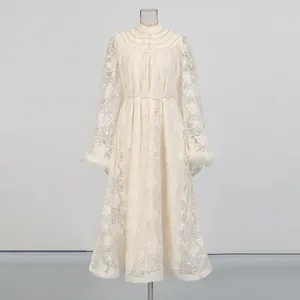 Elegant cream lace embroidered resort dress featuring feather cuffs and pearl button collar