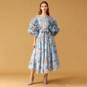 Full view of light blue dress featuring elegant rose prints and dramatic ruffled sleeves