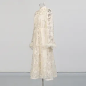 Elegant cream lace embroidery dress with stand collar and white feather cuff details.