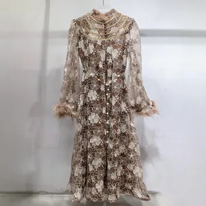 Elegant brown lace embroidered maxi dress featuring luxury feather cuffs and pearl buttons