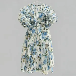 Elegant vintage rose print dress featuring dramatic puff sleeves and a large back bow detail