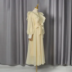Elegant vintage cream ruffled maxi dress with stand collar and chic waist tie detail.