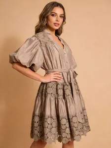 French pastoral style mini dress featuring V-neck, puff sleeves and hollow-out lace details