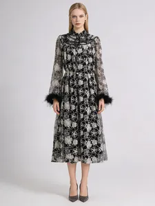 Elegant lace embroidered maxi dress with feather cuffs and a pearl belt accessory