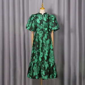 Detailed view of a French vintage floral midi dress with puff sleeves and belted waist.