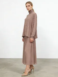 Elegant dusty rose two-piece rhinestone set with loose high-neck top and maxi A-line skirt