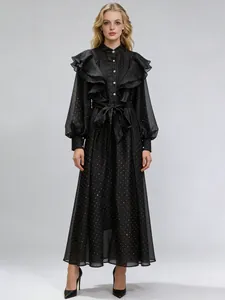 Elegant vintage palace style ruffled long dress with stand collar and gold polka dots