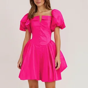 Front view of a French style fuchsia mini dress with puff sleeves and button detail.