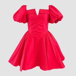 Close-up of red French style mini dress with puff sleeves and button-down front