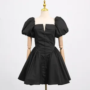 Elegant black French style puff sleeve mini dress shown on a professional display mannequin