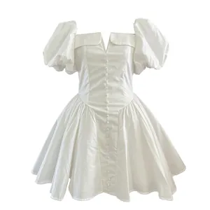Elegant French style white dress featuring puff sleeves and button-up front design
