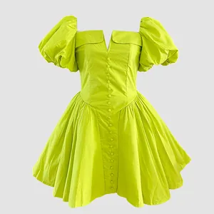 Close-up of a lime green French style puff sleeve mini dress with button front