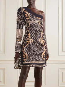 Detail view of baroque print one-shoulder dress with pearl embellishments.