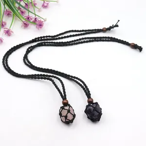 Detailed macro view of natural amethyst and rose quartz crystals in hand-woven cord pouches