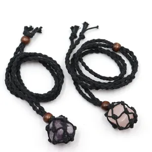 Detailed view of handmade black braided net necklace with amethyst and rose quartz stones