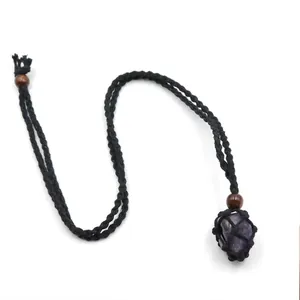 Detailed view of handmade braided rope necklace with raw purple amethyst stone pendant
