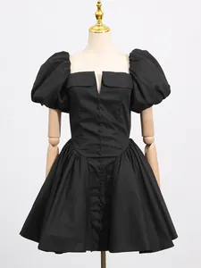 Elegant black puff sleeve high waist dress with button-front design on mannequin