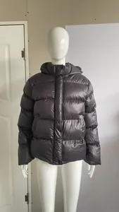 Detailed view of a stylish black men's hooded puffer jacket displayed on a mannequin
