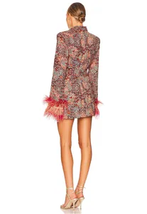 Back view showing intricate floral pattern and luxurious feather cuff details of the dress