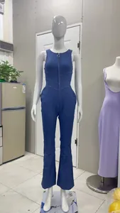 Detail of a slim fit sleeveless denim jumpsuit with front zip on a white mannequin