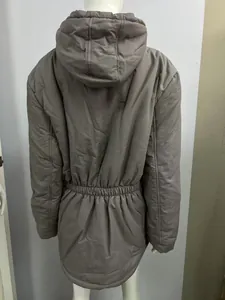 Detail shot showing the back of a brown hooded winter jacket with drawstring waist