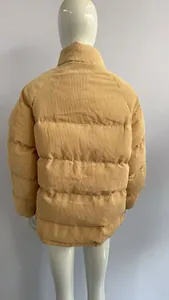 Back view of a yellow corduroy puffer jacket showing horizontal quilting details