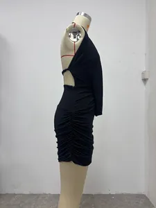 Side view of a sexy black halter backless dress with ruched details on a mannequin.