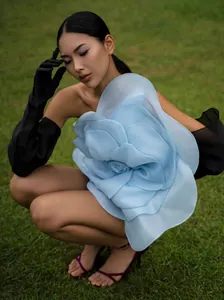 Elegant blue one-shoulder party dress featuring a large 3D floral decoration on the bodice