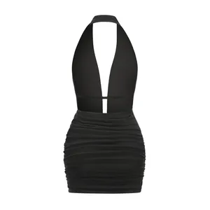 Detailed view of backless halter dress with deep V-neck and ruched bodycon skirt