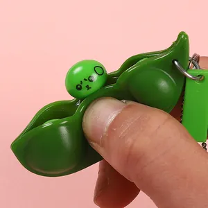 Quetsch-Erbsenschote Fidget Toy Schlüsselanhänger mit lustigem Gesicht zur Stressbewältigung