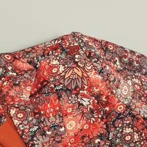 Close-up detail of high-end floral print fabric for an elegant women's dress jacket