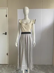 Elegant 2024 German Oktoberfest dress with ruffled sleeves and vertical striped maxi skirt.