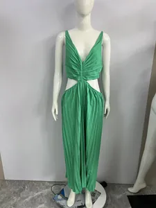 Front full view of a green V-neck sleeveless pleated maxi dress with waist cut-outs