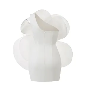 Elegant back view of white one-shoulder party dress with oversized organza flower detail