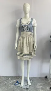 Traditional German Oktoberfest Dirndl dress with blue patterned bodice and beige skirt.