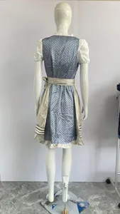 Rear view of a traditional blue floral Oktoberfest dirndl dress with apron on mannequin