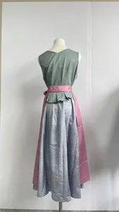 Back view of traditional German beer festival dress with pink apron and green top