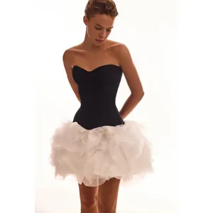 Chic two-piece black strapless corset with a white ruffled tulle mini puffy skirt