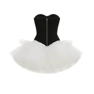 Detailed view of the black strapless corset paired with a white layered tulle tutu skirt.